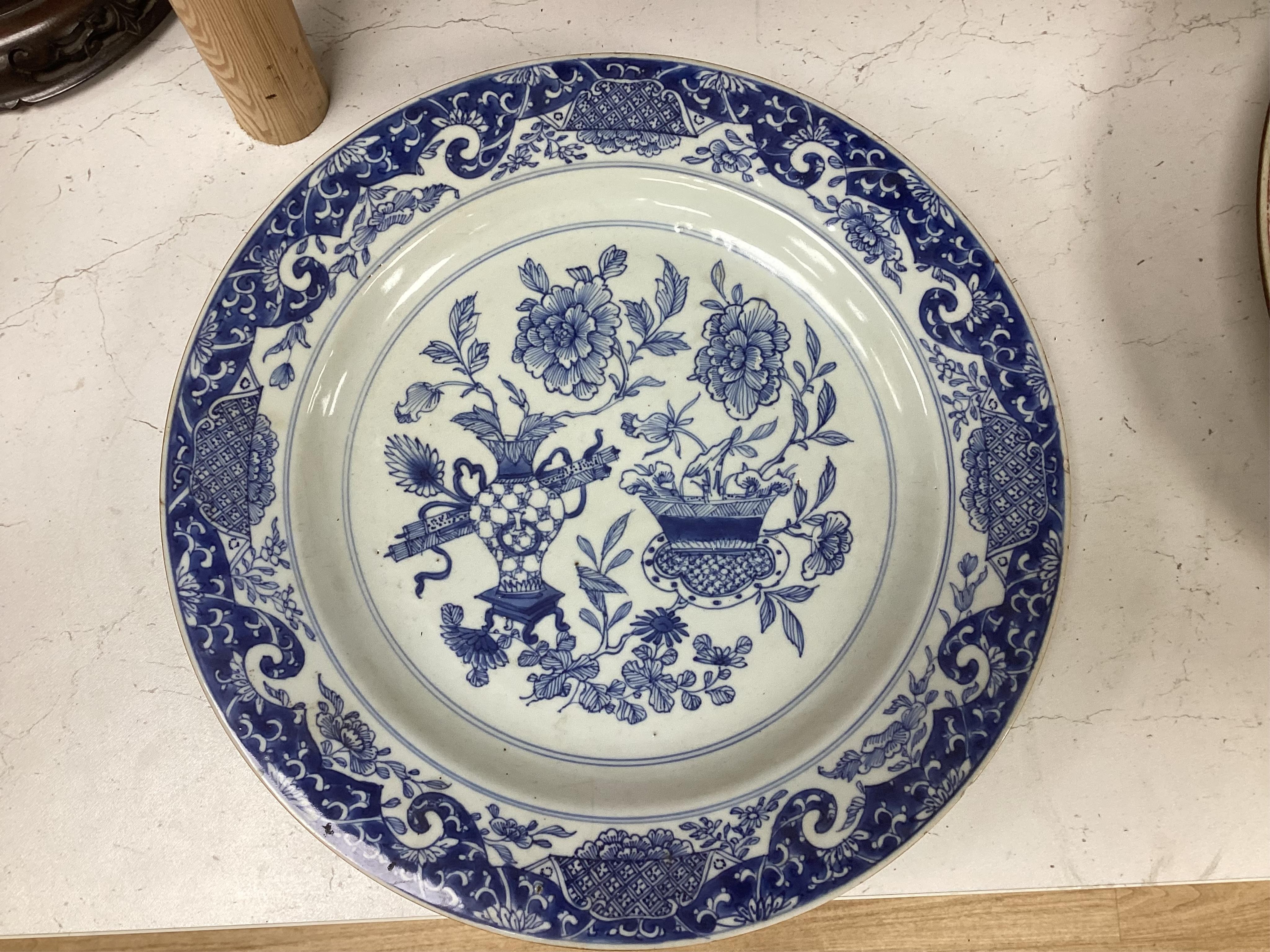 A Worcester teapot, c.1770, an 18th century Chinese famille rose and a blue and white dish, a small blue and white dish, a cup and saucer and teapot, largest dish 39cm (7). Condition - most damaged, cracked or chipped